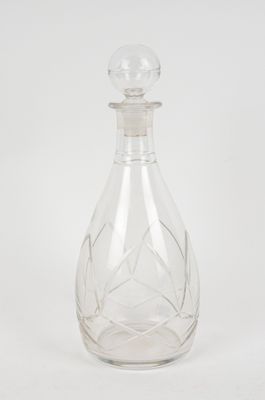 crystal decanter with a glass stopper on a white background