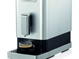 a close up of a coffee machine on a white surface