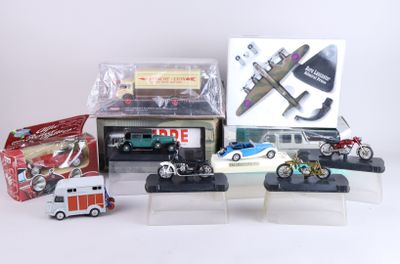 a lot of toy vehicles and a box on the table