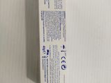 an empty box of toothpaste sitting on top of a white table