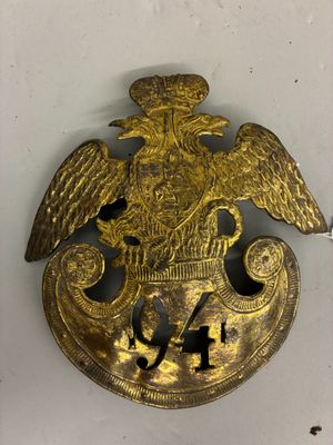 a close up of a brass plate with an eagle on it