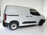 a white van that is parked in a white room