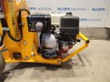 an image of a small machine that is parked in a garage