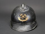 a black helmet with a gold emblem on it