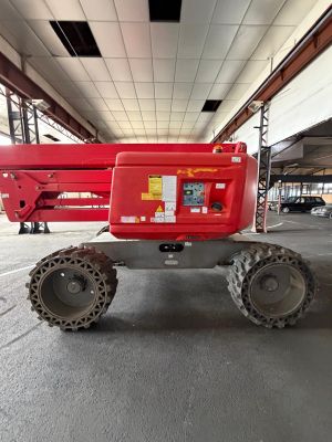 a red crane that is parked in a building
