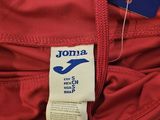a close up of a red pants with a label on it