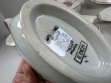 a person holding a white bowl with a label on it