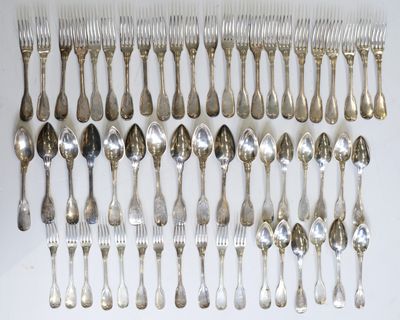 a lot of silver spoons and forks on the table