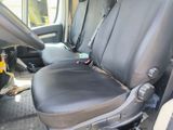 a seat in the back of a truck with a remote control