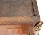 a close up of a wooden table with a drawer on it