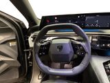 the interior of a car with a steering wheel and dashboard controls
