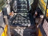 an image of a construction vehicle with a seat in the back