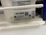 a close up of a sewing machine with a label on it