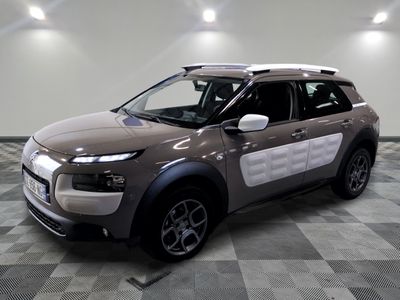 a picture of a car that is parked in a showroom