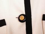 a close up of a jacket with a button on it