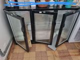 two glass doors that are open on the floor