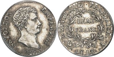 a silver coin with the head of a man on it