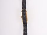 an image of a black watch with a gold clasp on a white background