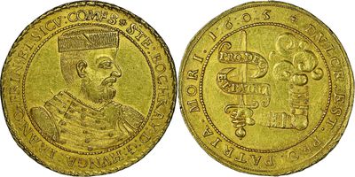 a gold coin with an image of a man on it