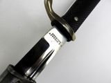 a close up of a knife on a white surface