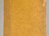 an old book sitting on top of a white table