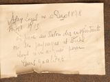 a piece of paper with writing on it sitting on a table