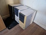 two microwaves sitting on top of each other on the floor