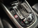 an image of a car ' s gear lever in the center console