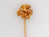 a gold colored stick with a dragon on it