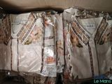 a box full of clothes that are wrapped in plastic