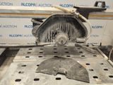 an image of a machine that is being used to cut a piece of metal