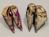 two pairs of chinese shoes are shown on a white surface