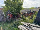 a pile of wood sitting in a yard next to a tree