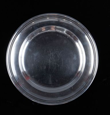 an image of a clear glass plate on a black background