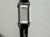 a close up of a wrist watch on a white surface
