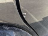 a reflection of a school bus in the side mirror of a car
