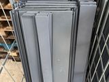 several pieces of metal are stacked on top of each other in a metal cage