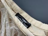 an image of a close up of a dress with a label on it