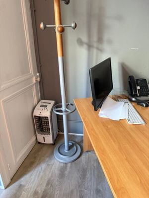a desk with a computer and a phone on it
