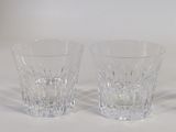 two glasses that are sitting on a white surface