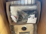 a cardboard box with a bunch of electronic equipment inside of it
