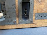 a close up of a metal object on a wooden surface