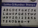 a close up of a sign with letters and numbers on it