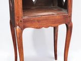 an old wooden table with a small shelf on top of it