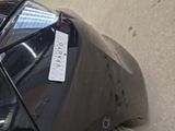 a sticker on the hood of a black car