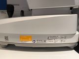 a close up of a white machine on a table