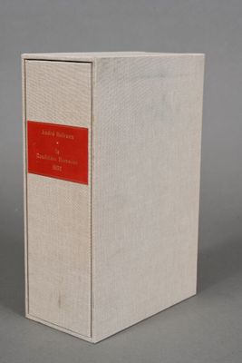 a white box with a red label sitting on top of a gray surface
