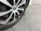 a close up of a tire on a car ' s rim