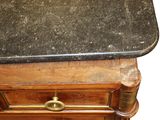 a black granite top on a wooden table
