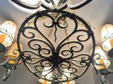 a chandelier that has a lot of lights hanging from it